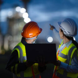 Operations and Maintenance Service In Field Support for Energy Generation. Rear View of Field Support Engineers working in a Power Plant to diagnose and enhanced plant performance during on-site service.