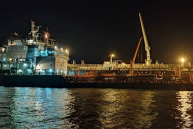 Tugboat,Push,Large,Cargo,Vessel,To,Berth,At,Port,Terminal.